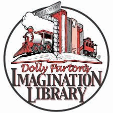 A row of books between two train bookends, resting on an open book. The caption reads Dolly Parton's Imagination Library