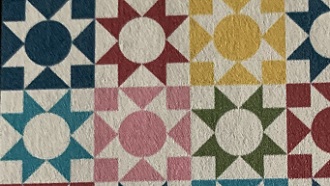 Multicolored quilt with moonstones pattern